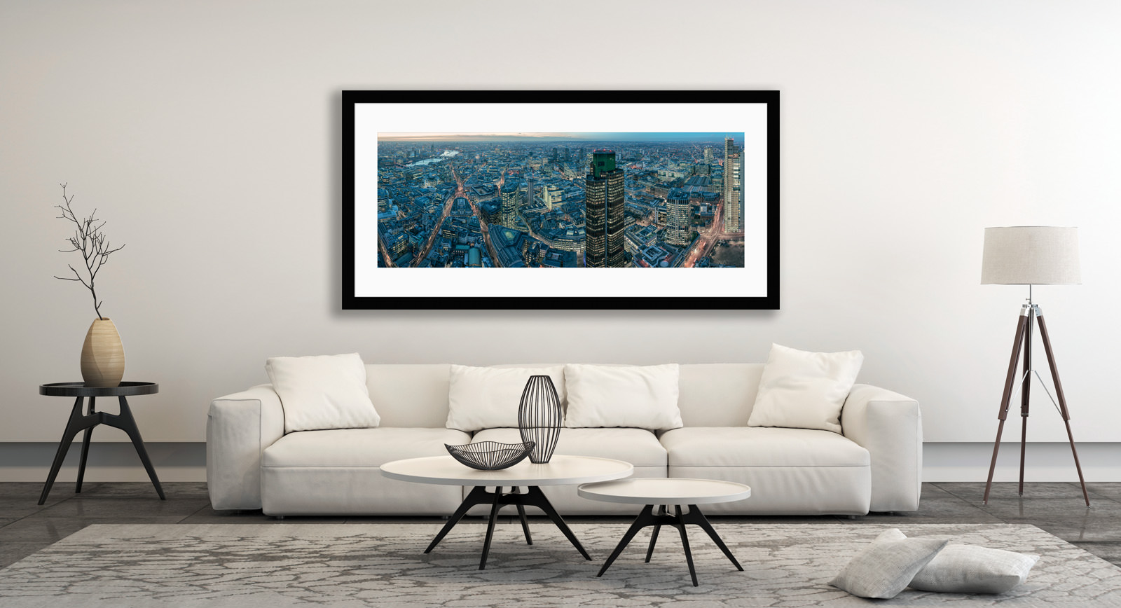 A framed fine art print of London from the Leadenhall hanging above a sofa in a living room